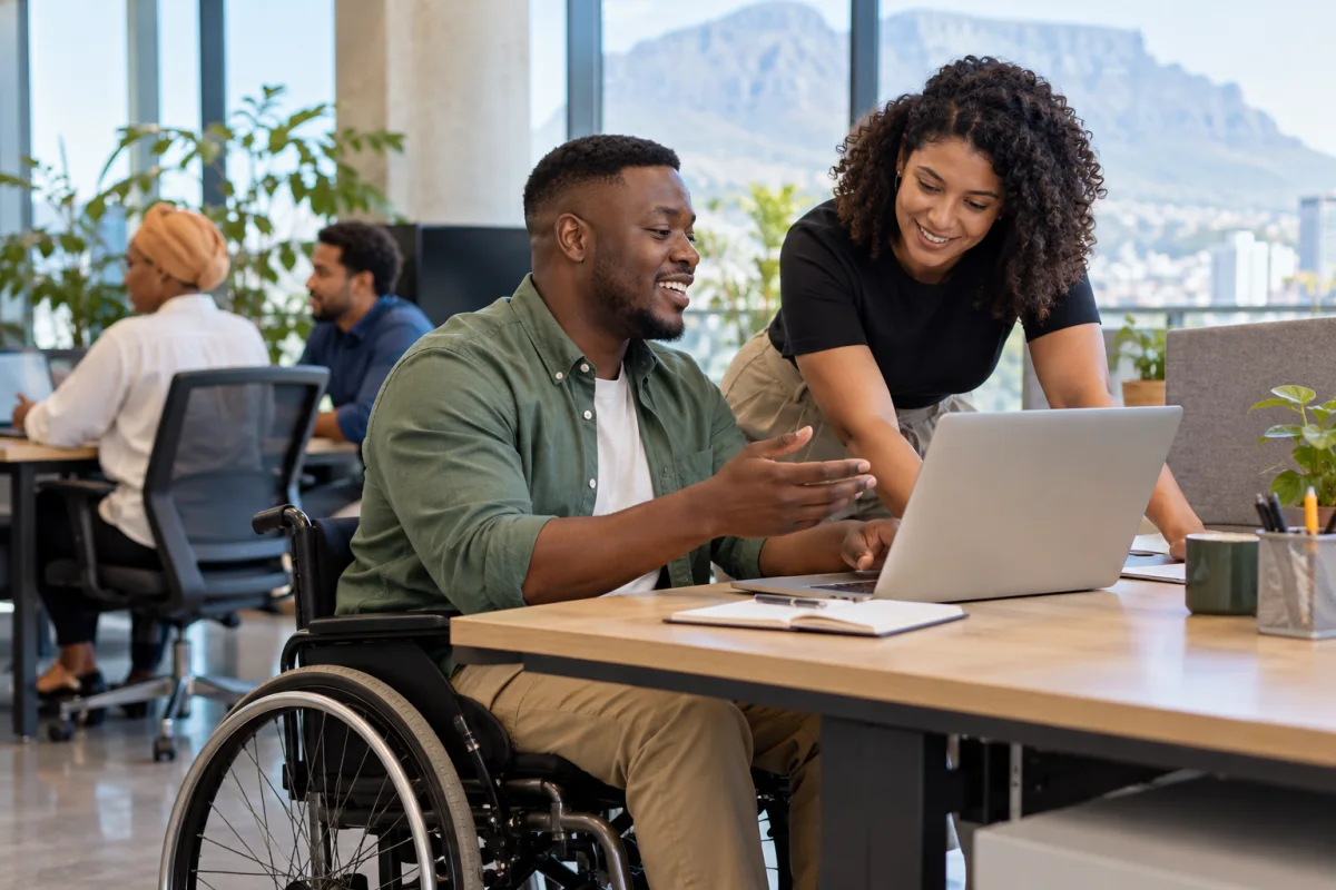 An accessible workspace with assistive equipment and a job application